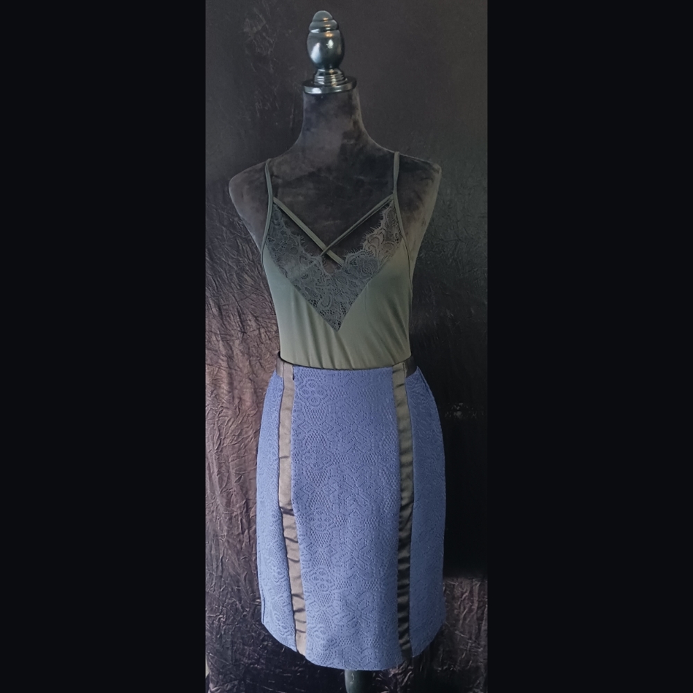Black bodysuit pair with navy blue skirt